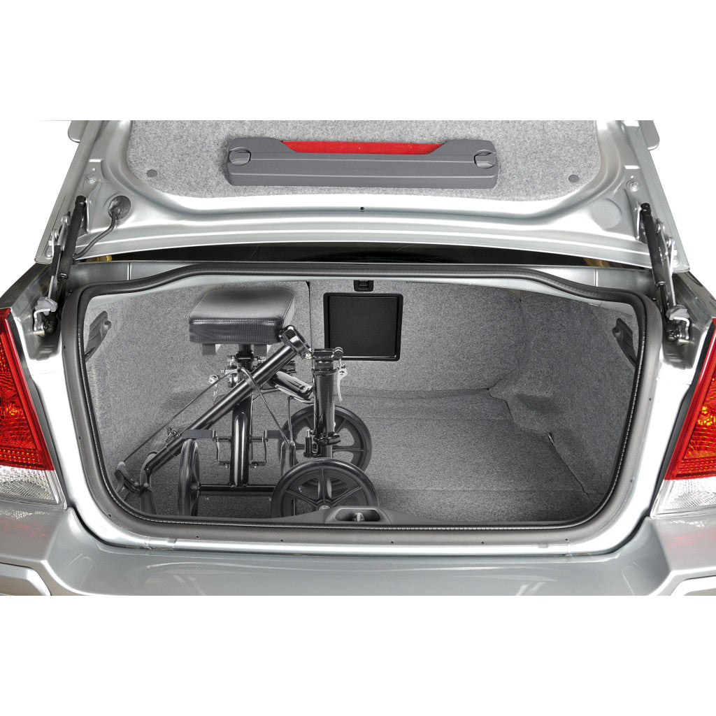 Open car trunk with a folded bicycle inside